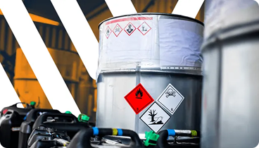 Barrel with WHMIS hazard labels in a warehouse