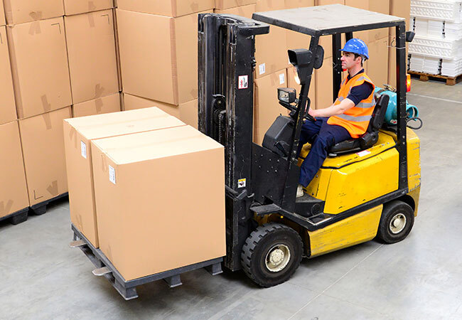 equipment-category-worker-driving-forklift-in-warehouse